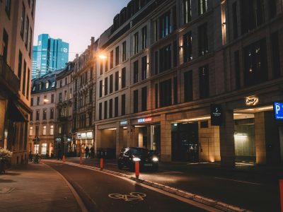 Elegant street view of Frankfurt Am Main at dusk, showcasing modern architecture.